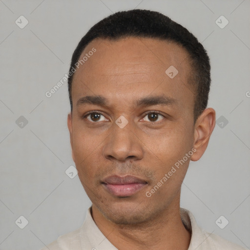 Neutral latino young-adult male with short  black hair and brown eyes