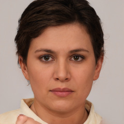 Neutral white young-adult female with short  brown hair and brown eyes