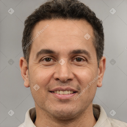 Joyful white adult male with short  brown hair and brown eyes