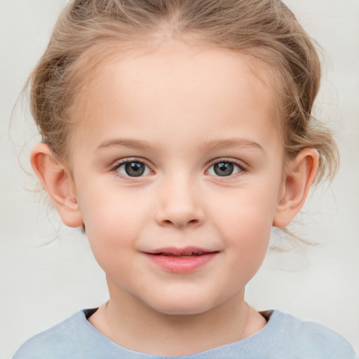 Joyful white child female with medium  brown hair and grey eyes