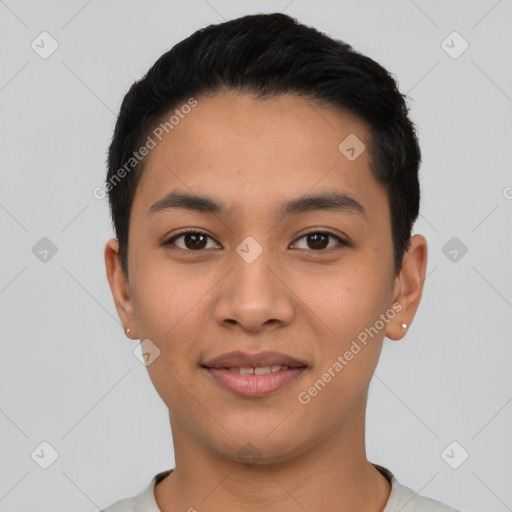 Joyful latino young-adult male with short  black hair and brown eyes