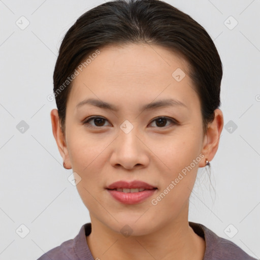 Joyful asian young-adult female with short  brown hair and brown eyes