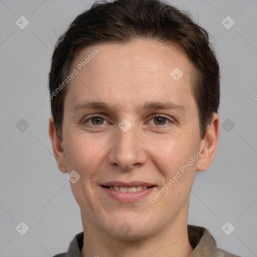 Joyful white adult male with short  brown hair and grey eyes