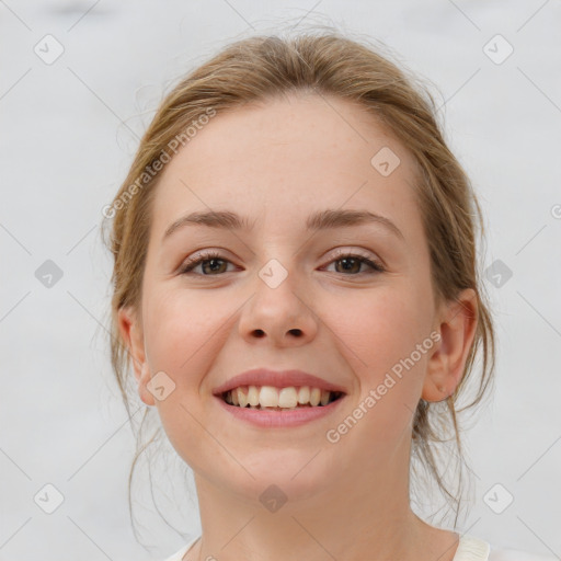 Joyful white young-adult female with medium  brown hair and blue eyes