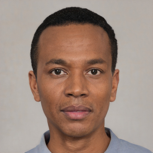 Neutral black young-adult male with short  black hair and brown eyes