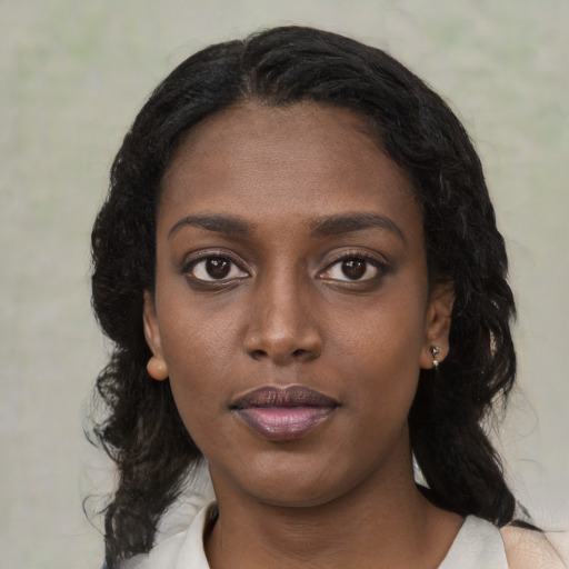 Neutral black young-adult female with medium  black hair and brown eyes
