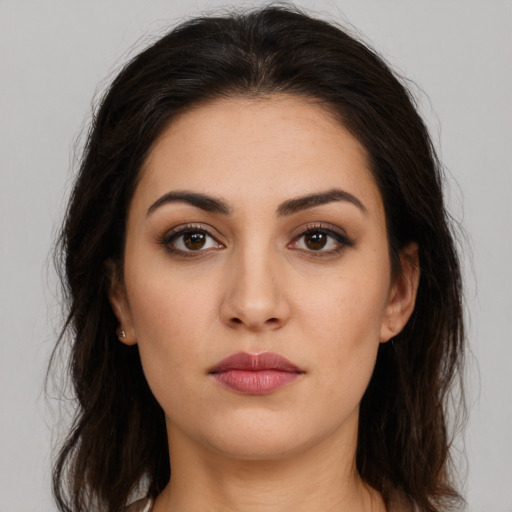 Neutral white young-adult female with long  brown hair and brown eyes