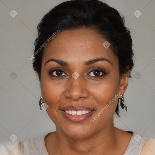 Joyful black adult female with short  brown hair and brown eyes