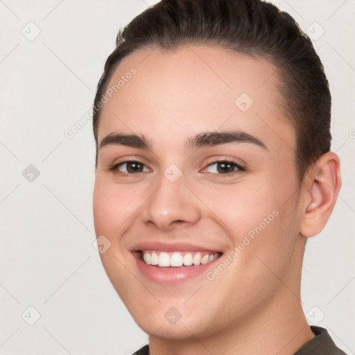 Joyful white young-adult female with short  brown hair and brown eyes