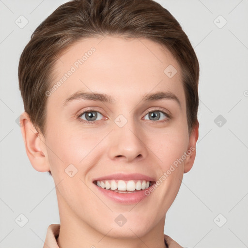 Joyful white young-adult female with short  brown hair and grey eyes