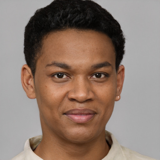 Joyful black young-adult male with short  black hair and brown eyes