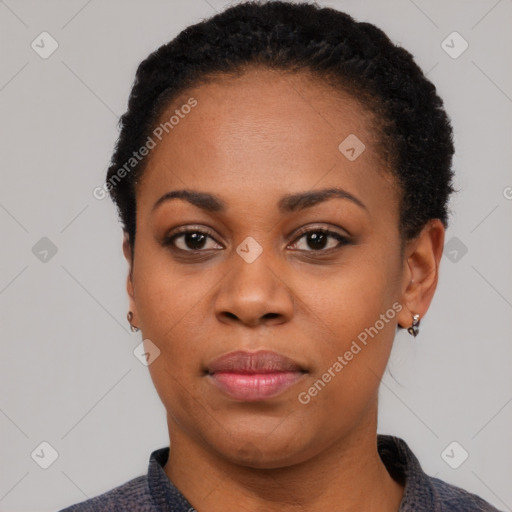 Joyful black young-adult female with short  black hair and brown eyes