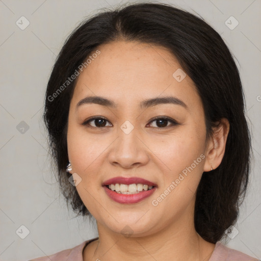 Joyful latino young-adult female with medium  brown hair and brown eyes