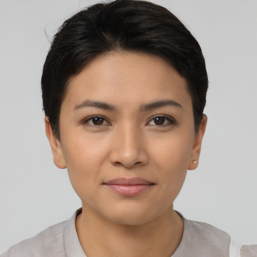 Joyful asian young-adult female with short  black hair and brown eyes