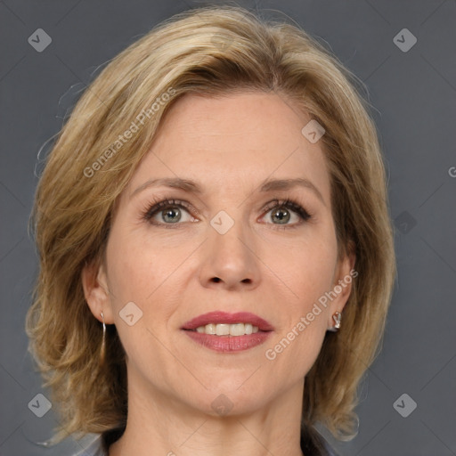 Joyful white adult female with medium  brown hair and grey eyes