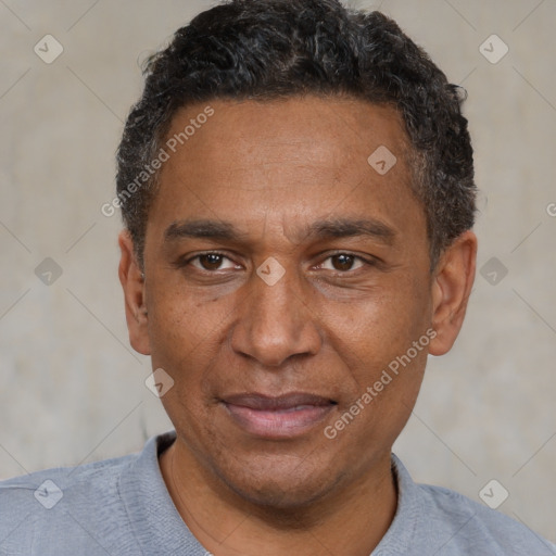 Joyful black adult male with short  black hair and brown eyes