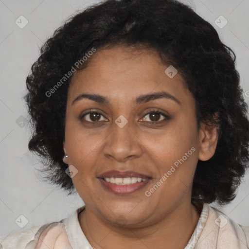 Joyful black young-adult female with long  brown hair and brown eyes