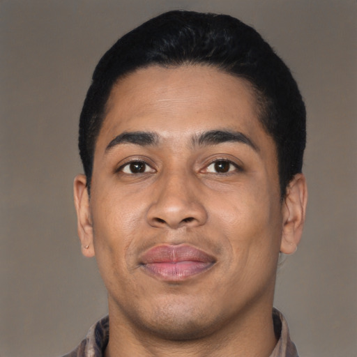 Joyful latino young-adult male with short  black hair and brown eyes