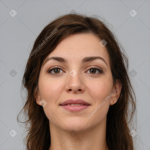 Joyful white young-adult female with long  brown hair and brown eyes