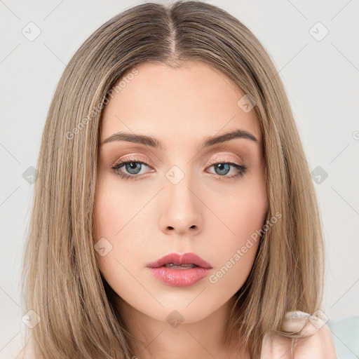 Neutral white young-adult female with long  brown hair and brown eyes