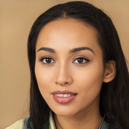 Joyful latino young-adult female with long  black hair and brown eyes