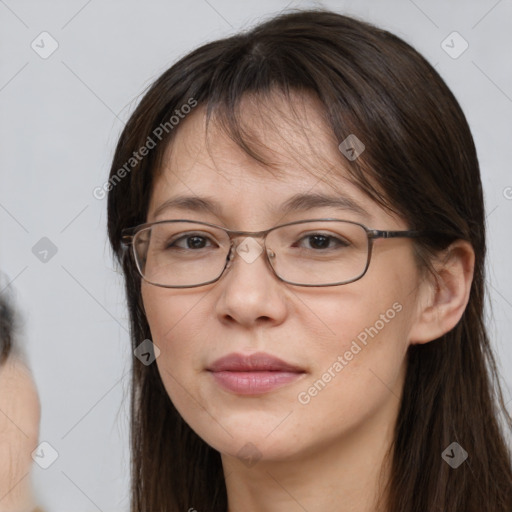 Joyful white adult female with long  brown hair and brown eyes