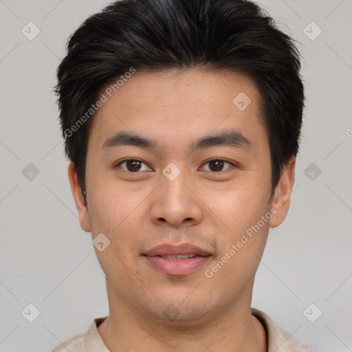 Joyful asian young-adult male with short  brown hair and brown eyes