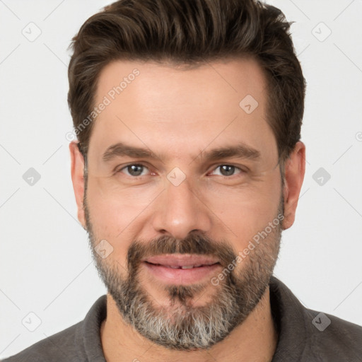 Joyful white adult male with short  brown hair and brown eyes