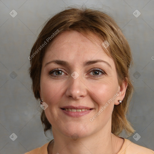 Joyful white adult female with medium  brown hair and grey eyes