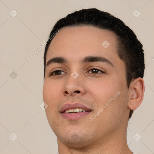 Joyful white young-adult male with short  black hair and brown eyes