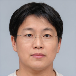 Neutral asian adult male with short  brown hair and brown eyes