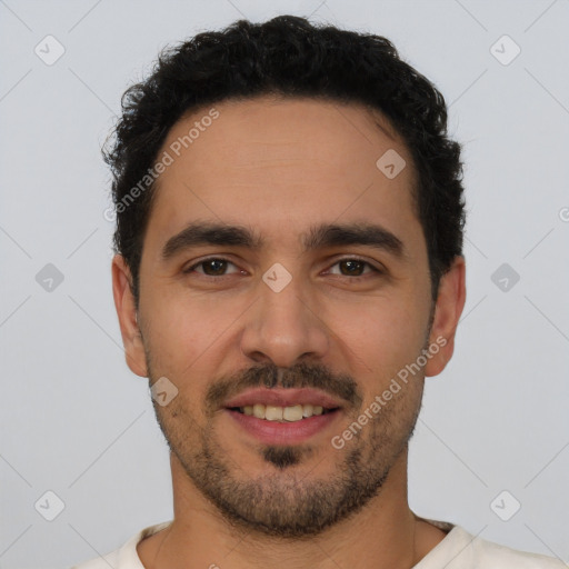 Joyful white young-adult male with short  black hair and brown eyes