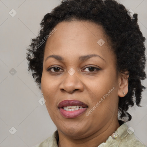 Joyful black adult female with short  brown hair and brown eyes