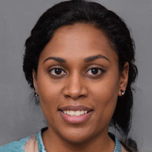 Joyful latino young-adult female with medium  black hair and brown eyes