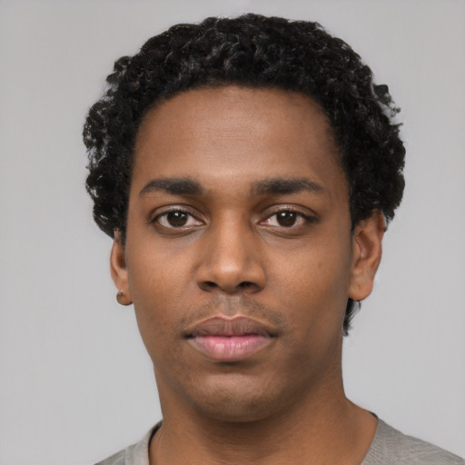 Neutral black young-adult male with short  black hair and brown eyes