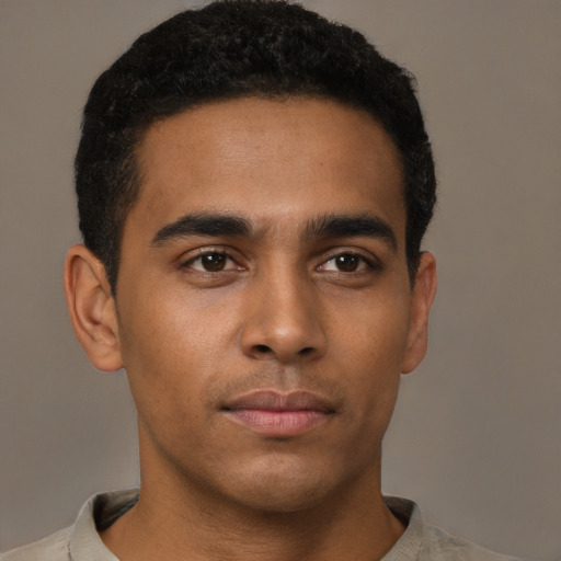 Neutral latino young-adult male with short  brown hair and brown eyes