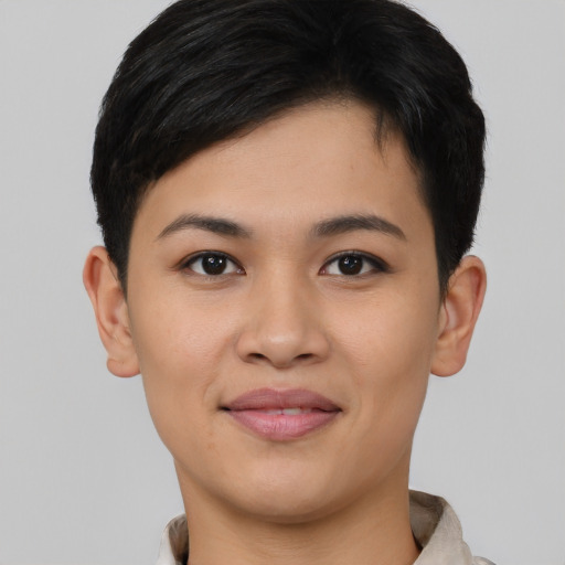 Joyful asian young-adult female with short  brown hair and brown eyes