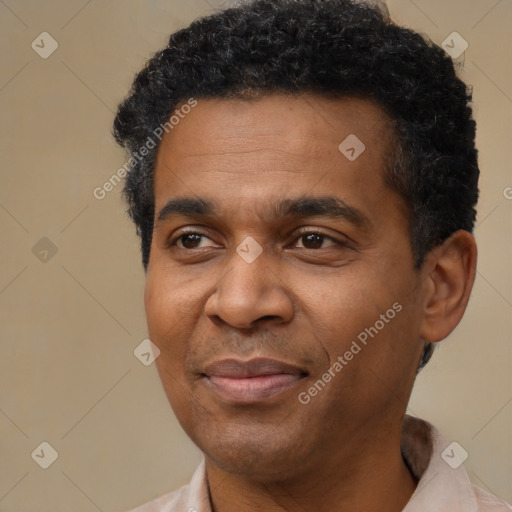 Joyful latino adult male with short  black hair and brown eyes