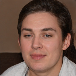 Joyful white young-adult male with medium  brown hair and brown eyes