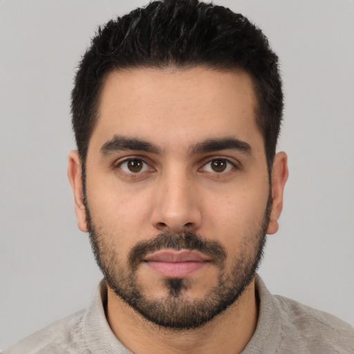 Neutral white young-adult male with short  black hair and brown eyes