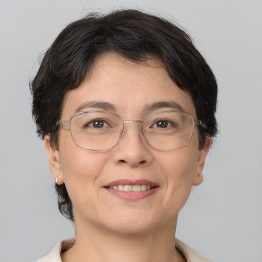 Joyful white adult female with short  brown hair and brown eyes