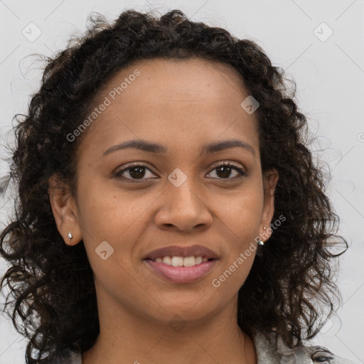 Joyful black young-adult female with long  brown hair and brown eyes