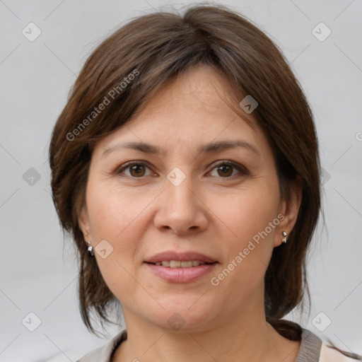 Joyful white adult female with medium  brown hair and grey eyes