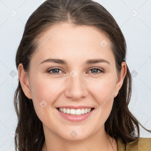 Joyful white young-adult female with long  brown hair and grey eyes