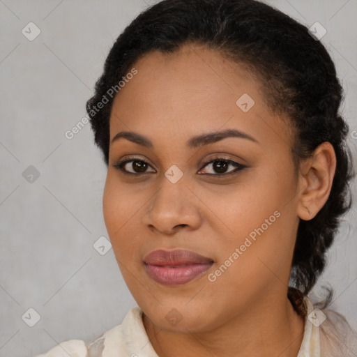 Joyful black young-adult female with long  brown hair and brown eyes