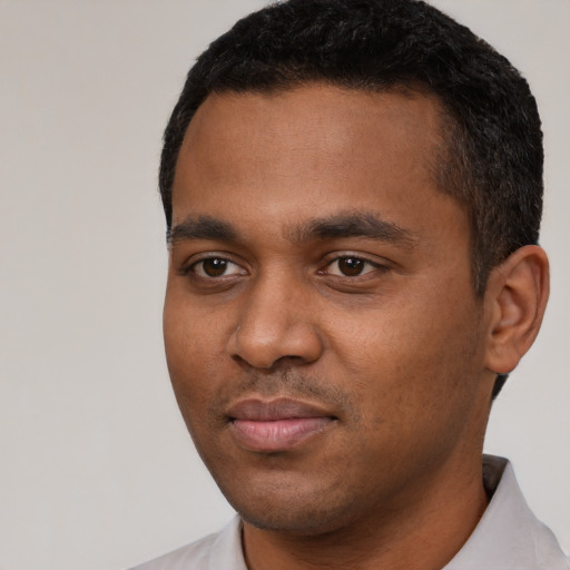 Neutral black young-adult male with short  black hair and brown eyes