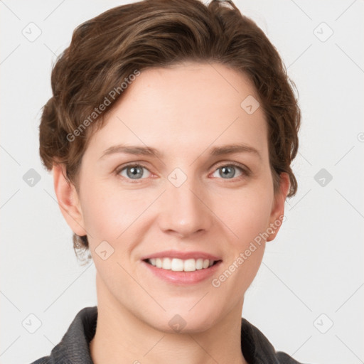 Joyful white young-adult female with short  brown hair and grey eyes