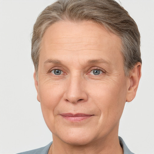 Joyful white middle-aged male with short  brown hair and grey eyes