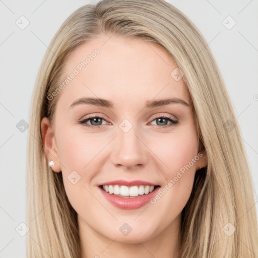 Joyful white young-adult female with long  brown hair and blue eyes