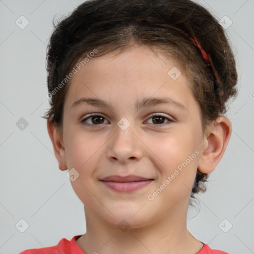 Joyful white child female with short  brown hair and brown eyes